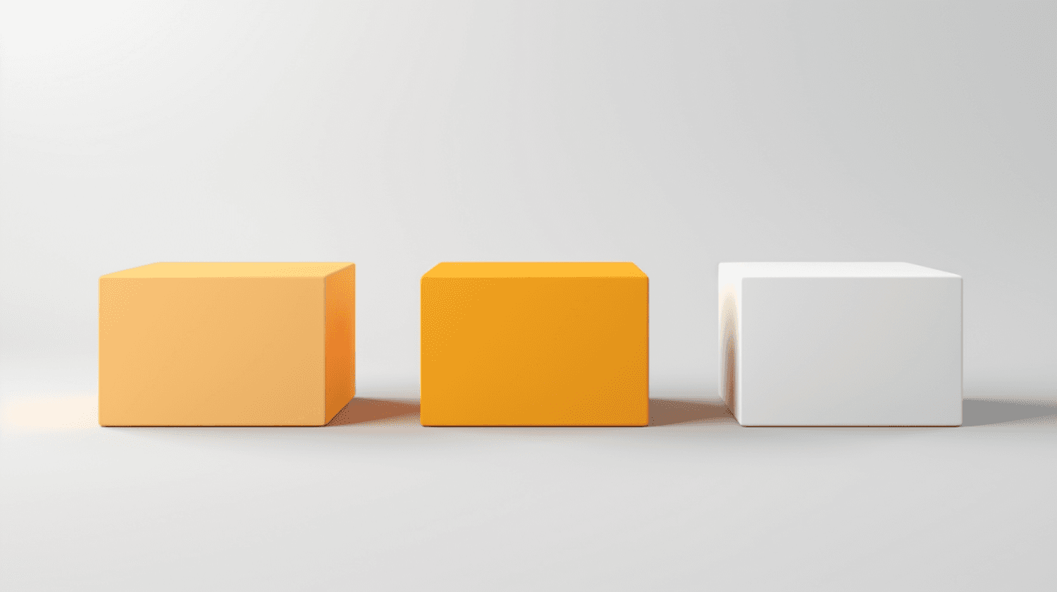 Three cubes in soft orange, bright orange and white on a grey ground